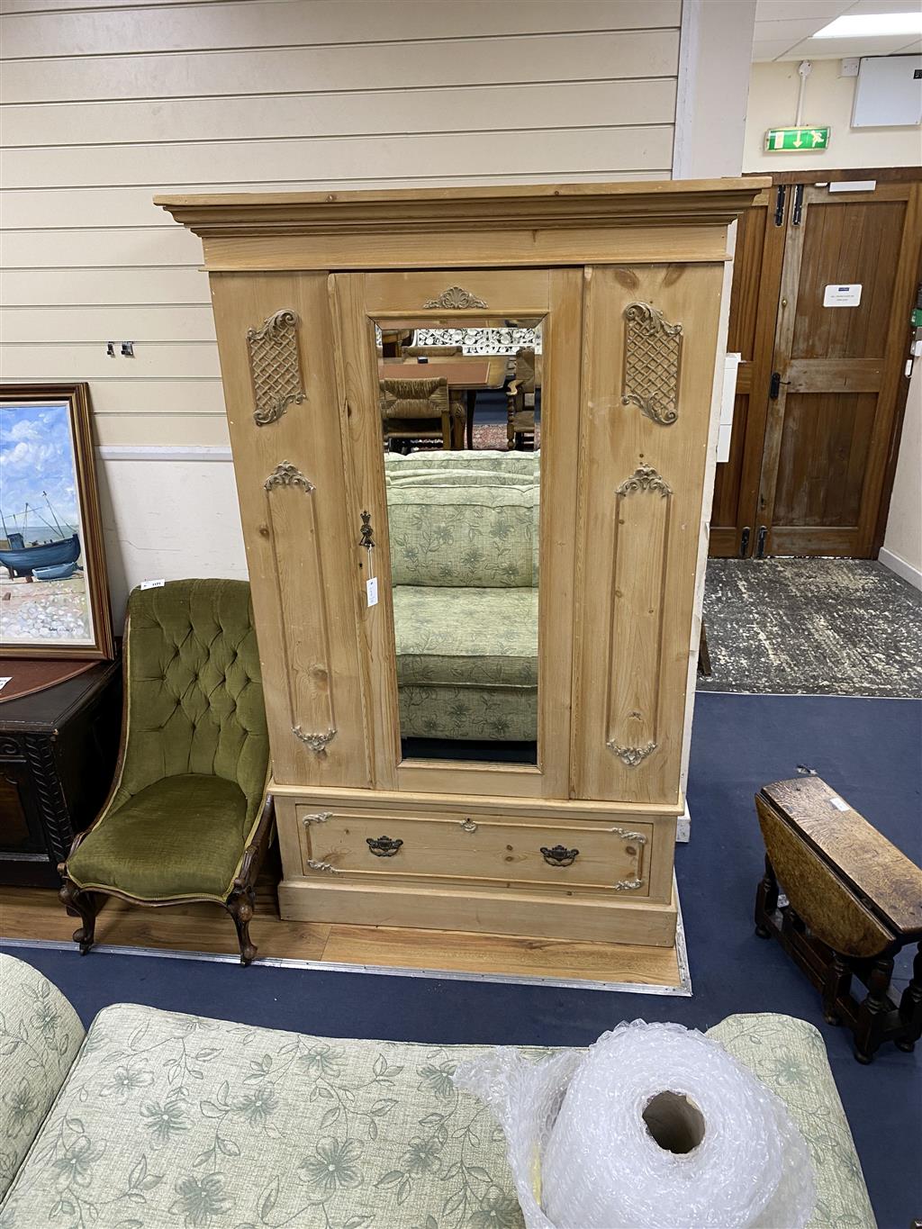 An Edwardian pine mirrored door wardrobe, width 124cm, depth 52cm, height 199cm